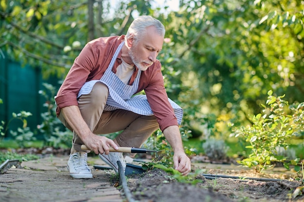 Senior gardening while seated