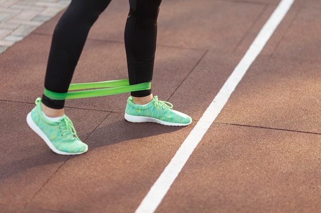 Man performing resistance band marches