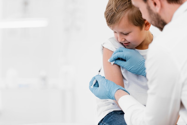 Young child receiving a vaccine at a pediatric clinic