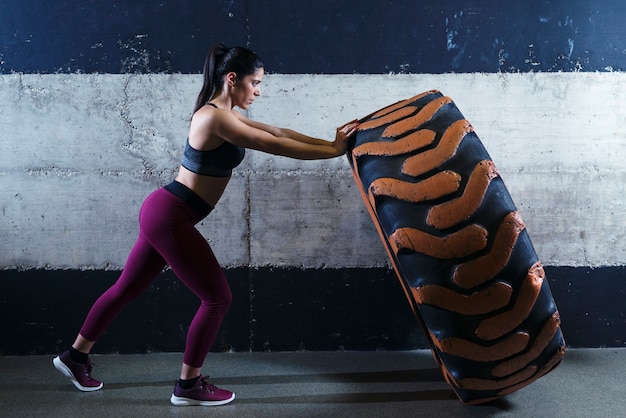 Runner performing farmer's carry with dumbbells