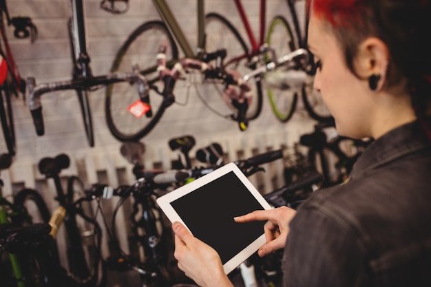 Cycling gear laid out including helmet, lock, lights, and backpack