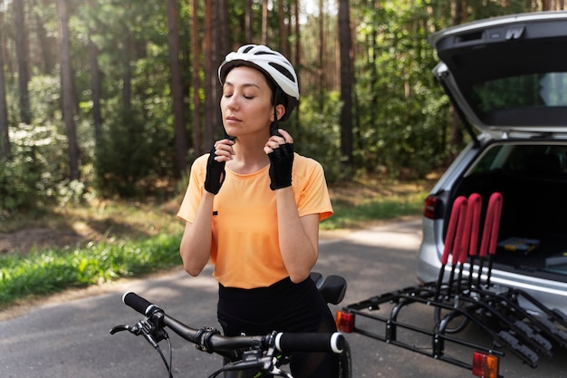 Cyclist taking a mindful breath at a rest stop