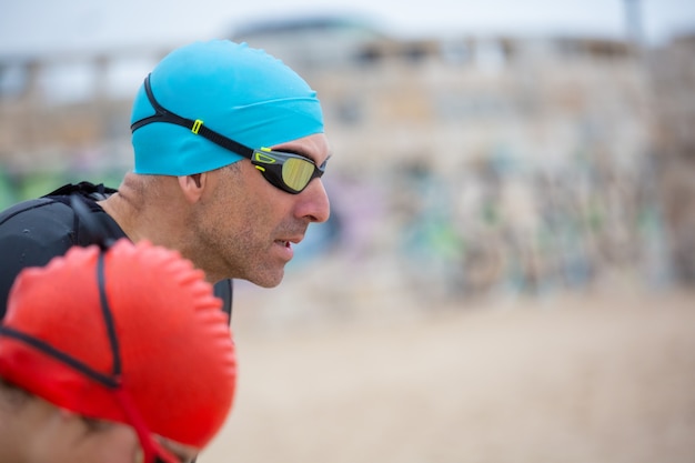 Swimmer doing resistance band exercises at home