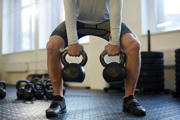 Person performing dumbbell exercises at home