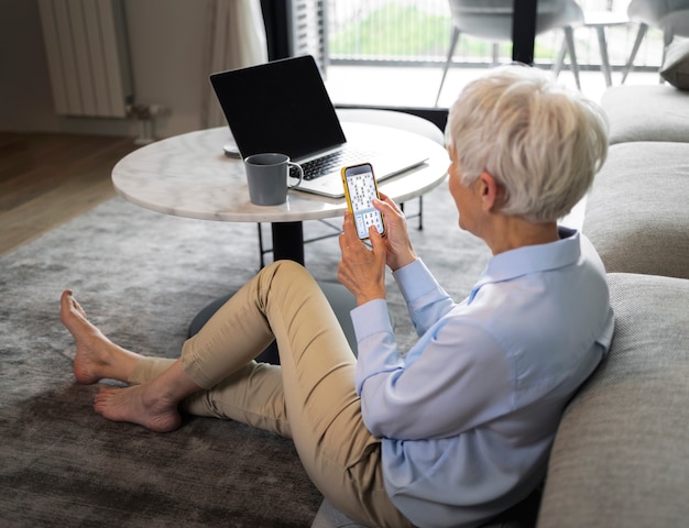 Elderly person being monitored via Wi-Fi in a home setting