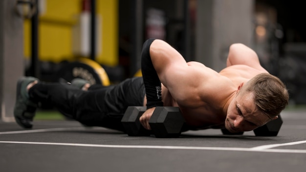 Person performing a dumbbell squat with proper core engagement