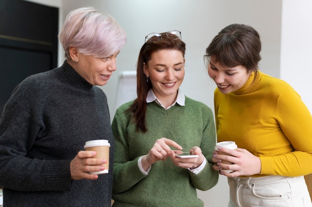 Teenager texting on smartphone while parent looks on