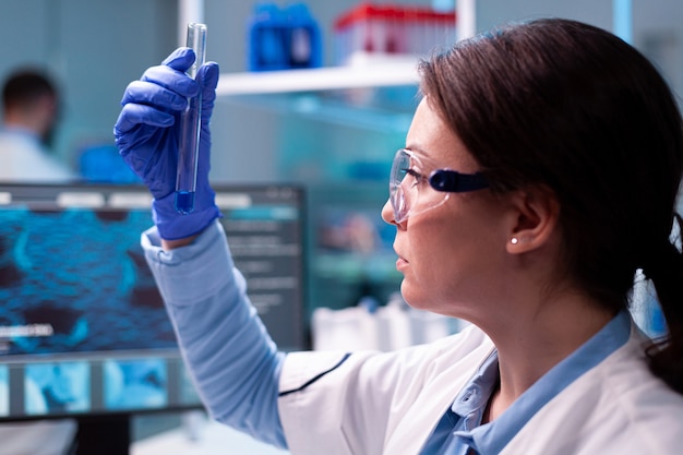 A scientist analyzing DNA in a laboratory setting