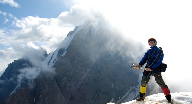 Hiker breathing deeply at mountain viewpoint