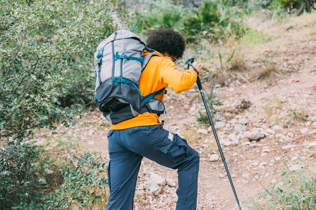 Cyclist hiking on a forest trail
