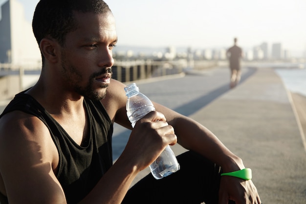 Person drinking water after a workout