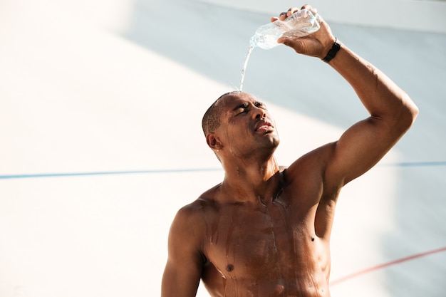 Swimmer drinking water after a lap