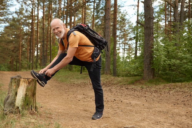 Hiker descending trail with trekking poles