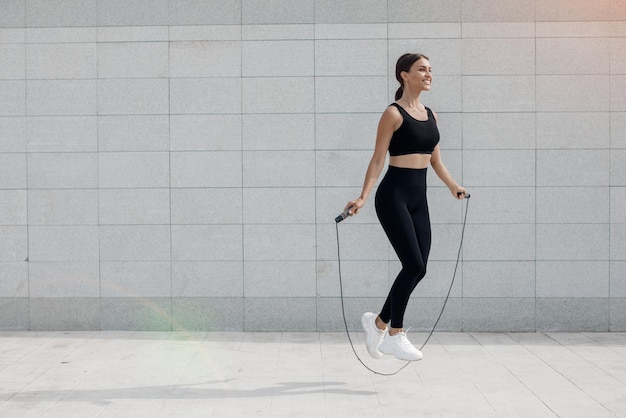 Person jumping rope in workout clothes