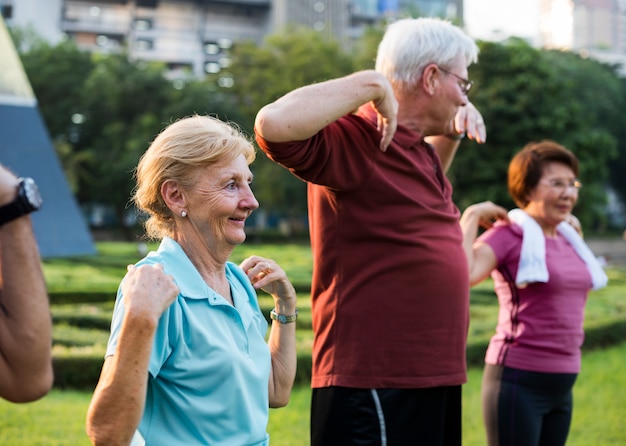 Senior performing seated arm cycling exercise