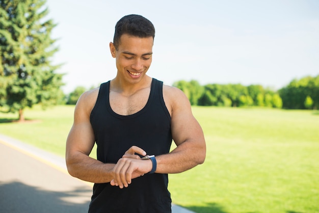 Man checking fitness stats on a smartwatch
