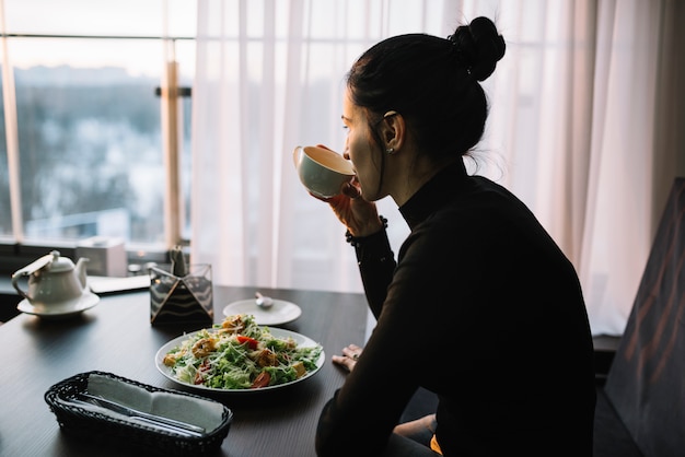 Professional eating mindfully away from their desk