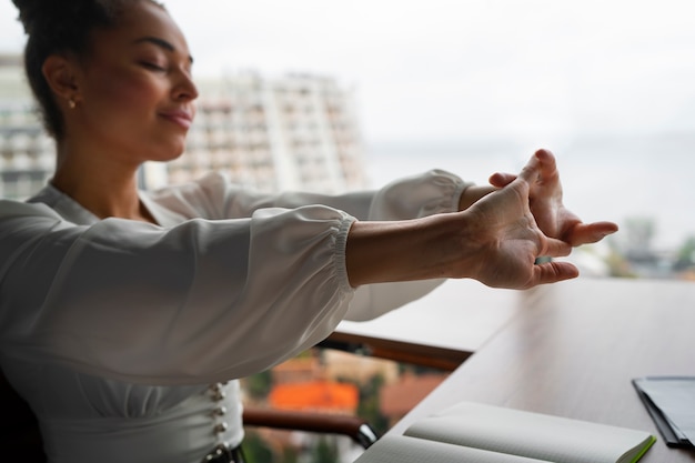 Man practicing morning breathwork by a window