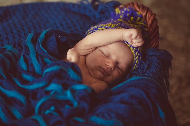 Newborn baby wrapped in a swaddle blanket