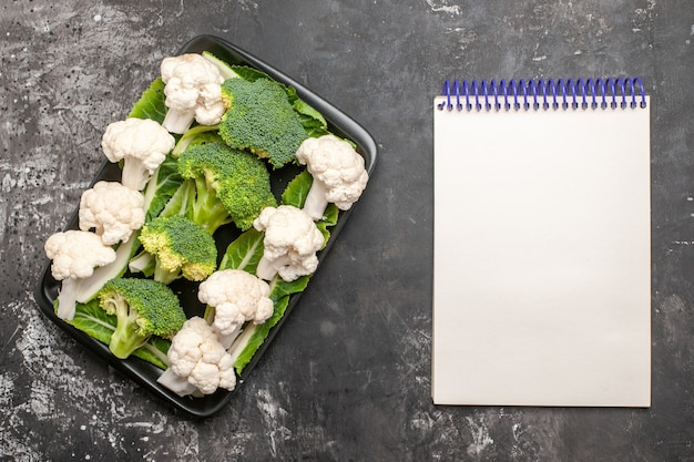 Close-up of raw broccoli florets with nutritional facts overlay