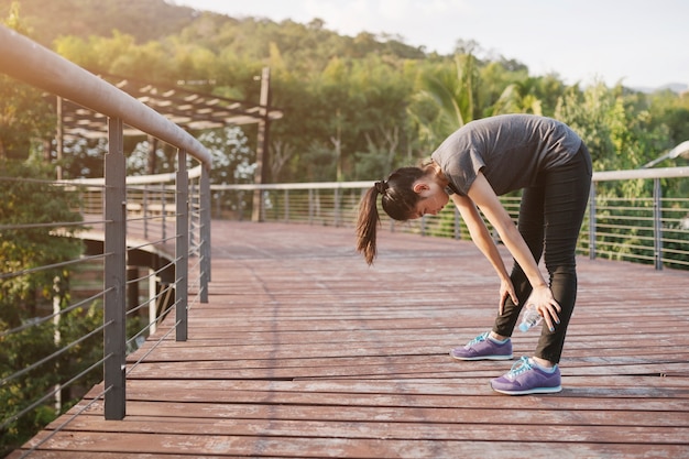 Runner performing a seated hamstring stretch