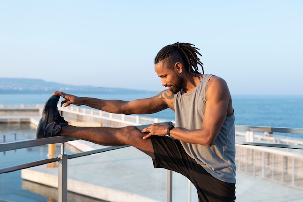 Man warming up on treadmill before strength training