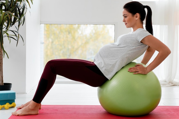 Pregnant woman doing gentle stretches