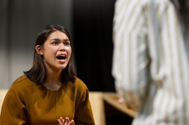 Person giving a presentation with calm demeanor