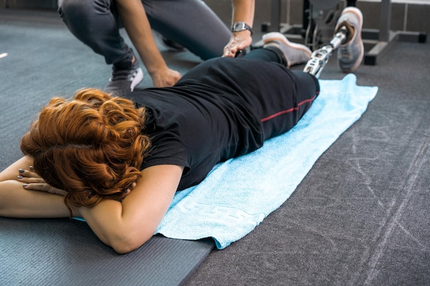 Person performing a recovery circuit with resistance band and mat