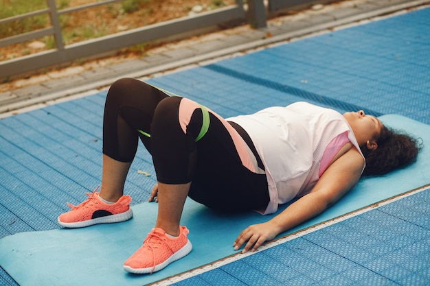 Woman doing bodyweight squats at home