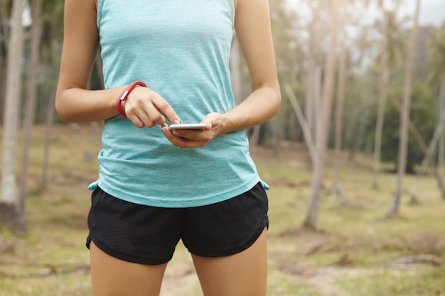 Runner jogging on a park trail during early morning