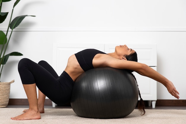 Swimmer using a stability ball for core workouts