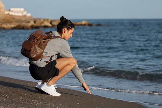 Traveler stretching legs near a park bench