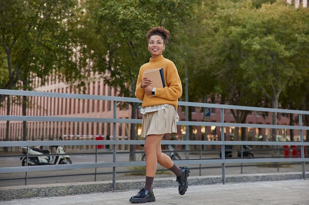 Student walking to class with backpack