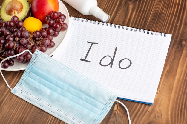 People wearing masks and practicing good hygiene in a clinic setting
