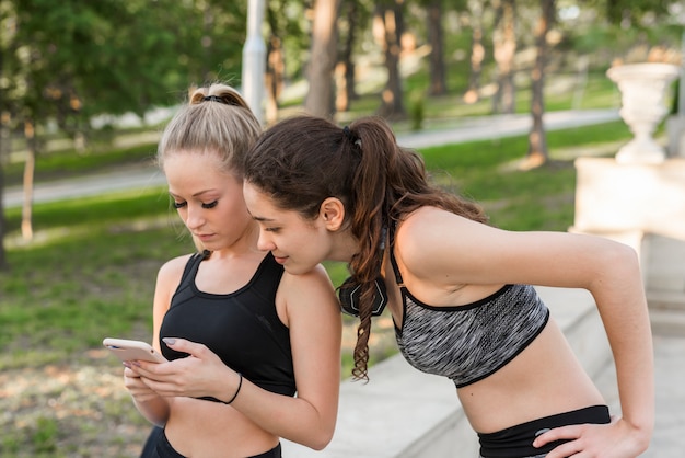 Teen checking posture in mirror during rehab exercise