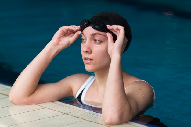 Teen swimming laps in a pool
