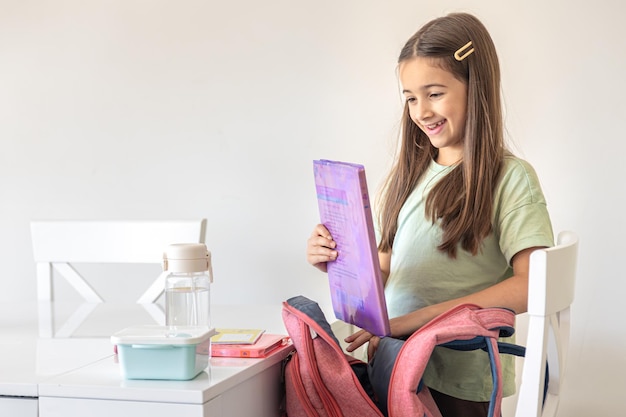 Teen using a journal to track daily habits and goals