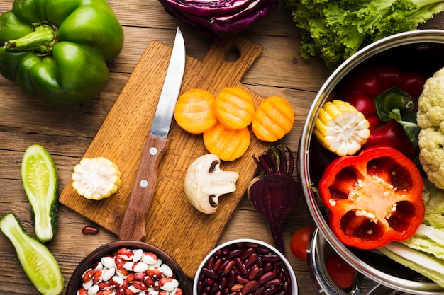 Fresh vegetables being sautéed in a pan with olive oil