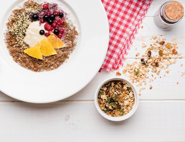 Oatmeal with seeds and fruit in a bowl