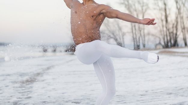 Person stretching outdoors in cold weather