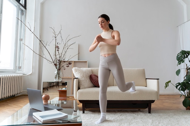 Woman doing bodyweight exercises at home