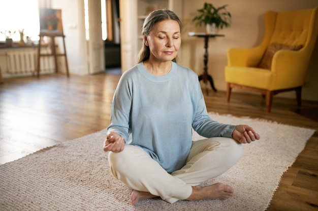 Woman practicing mindfulness to reduce back pain