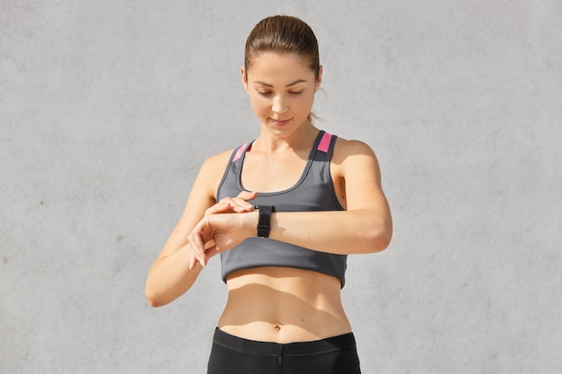 Woman checking fitness tracker