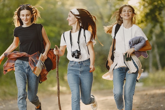 Two women hiking on a forest trail